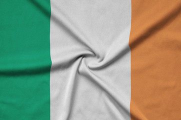 Ireland flag  is depicted on a sports cloth fabric with many folds. Sport team banner