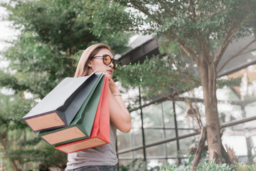 Woman in shopping. Happy woman with shopping bags enjoying in shopping. shopping  lifestyle concept