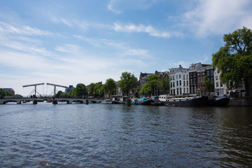 Fototapeta na wymiar Dutch canal scene in Amsterdam in the Netherlands