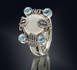 Golden ring with gemstone isolated on black background