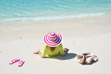 Fototapeta na wymiar Girl on the beach. Great Exuma, Bahamas
