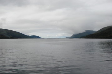Obraz premium Panorama of the Gulf of Scotland Fjords against the background of the cloudy northern sky.
