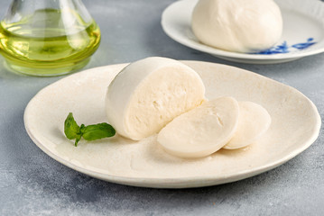 Sliced Mozzarella Buffalo with basil leaves