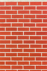 Bright Red Brick Wall in Vertical Format