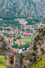 Fototapeta na wymiar View from above to the Kotor city and mountains on Adriatic sea coastline in Montenegro, gorgeous landscape