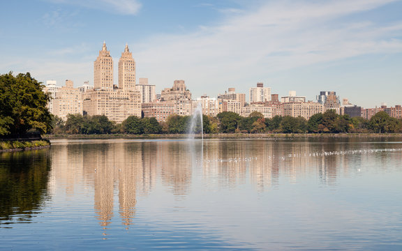 Jackie Onassis Reservoir.  The view across the Jackie Onassis Reservoir in Central Park, New York City on a still autumn morning.