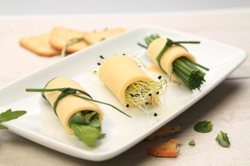 Cheese slices with green spices