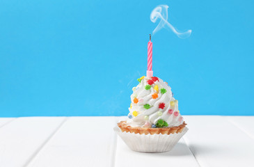 cake with extinct candles on a blue background