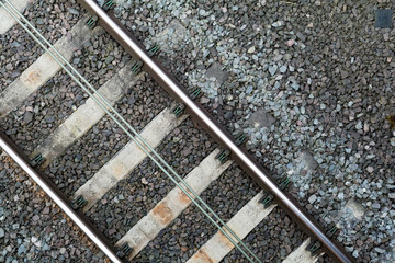 Naklejka premium Section of train tracks on the rail line, overhead shot