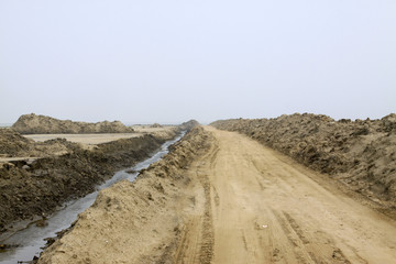 Dirt roads and drainage ditch