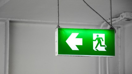 green fire exit sign in the building