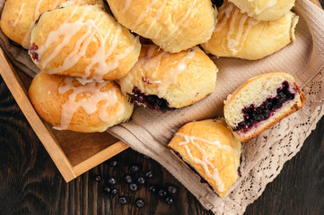 Homemade sweet buns with wild blueberry filling.