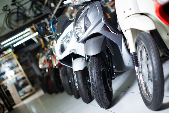 Image of modern different colors motorbikes in the shop