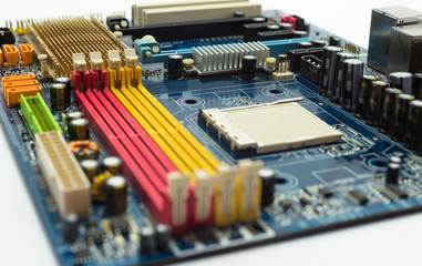 Motherboard with visible PCI express connector slot, heat sink, memory slot, cpu socket in blue.