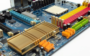 Motherboard with visible PCI express connector slot, heat sink, memory slot, cpu socket in blue.
