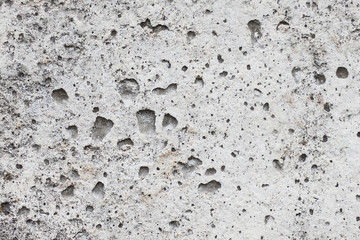 Gray concrete texture with uneven depths. Use of concrete in construction_