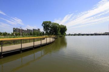 Fototapeta premium Wide water surface and buildings