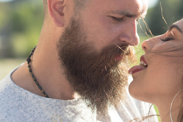 Kiss me right now. Sensual woman stick out tongue to man. Couple in love. Feeling flirty. Bearded man and woman enjoy intimacy