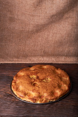 apricot cake on a dark wood background. tinting. selective focus