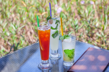 Three beautiful exotic coctail in nature background