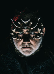 Alien, demon, sorcerer makeup. Man with third eye, thorns or warts. Demon on black background,...