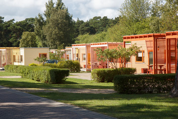 a camping cottages surrounded by green trees