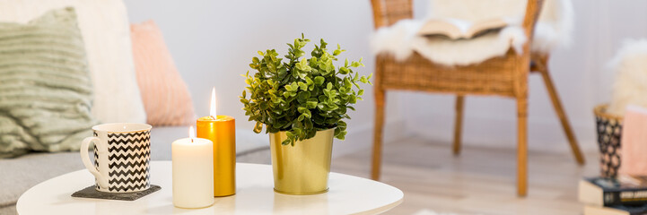 Candles on white coffee table