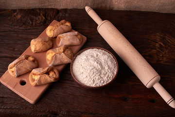 Close up Flour bread and whole grain , rolling pin and Cottage cheese cookies. Concept of homemade food