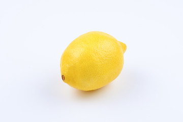 Lemon isolated on yellow background.