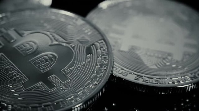 Silver Bitcoin Cryptocurrency on motherboard. Virtual Coins. Business concept