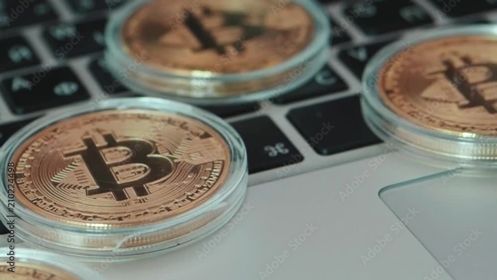 Aufkleber bitcoin on keyboard. bitcoin currency with blockchain concept on laptop keyboard with coins and char