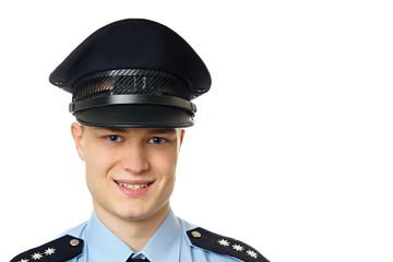 Portrait of young policeman in uniform, at right you can write some text.