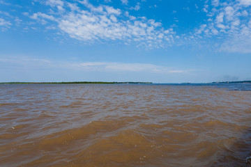 Meeting of Waters. Brazilian rivers confluence from Manaus