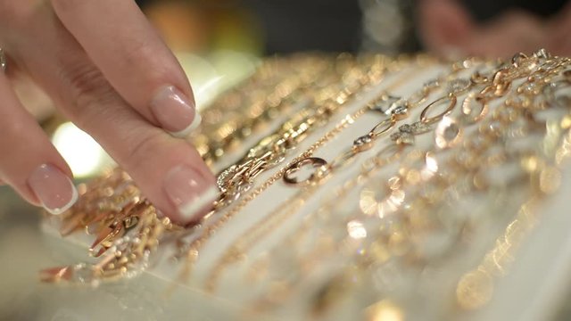 Jewels Market - the seller shows gold jewelry earrings, rings, bracelets, chain