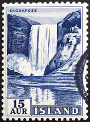 Waterfall Skogafoss on vintage icelandic postage stamp