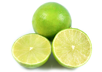 Naklejka na ściany i meble Juicy slice of lime, citrus fruit with green lemon half isolated on white background, Tropical fruit, Flat lay, top view.