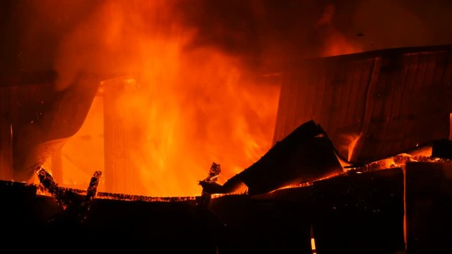Fire Gushing From A House Roof