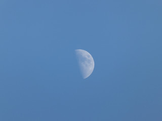 Obraz na płótnie Canvas The moon seen in the morning sky