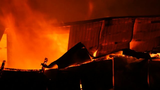 House Burning With Fire Coming Out Of It