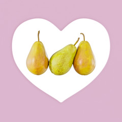 Three pears on a background of a pink heart