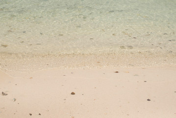 Fototapeta na wymiar Clear water of the sea and sand beach.