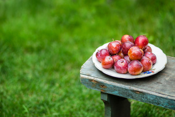 red plums on the table