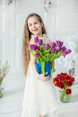 Little beautiful little girl with blonde long hair