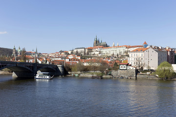 Spring Prague gothic Castle with the Lesser Town above River Vltava in the sunny Day, Czech Republic