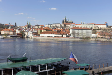 Fototapeta premium Spring Prague gothic Castle with the Lesser Town above River Vltava in the sunny Day, Czech Republic