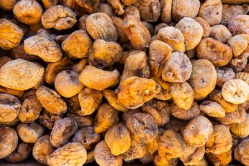 dried figs in large quantity, vegetative background