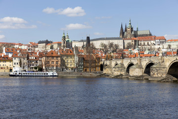 Fototapeta na wymiar Spring Prague gothic Castle and Charles Bridge with the Lesser Town in the sunny Day, Czech Republic