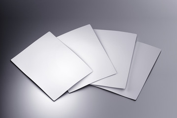 White glossy shiny cards laying on the surface. Branding mock up. 3D illustration.