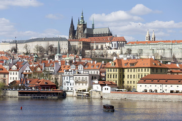 Fototapeta premium Spring Prague gothic Castle with the Lesser Town above River Vltava in the sunny Day, Czech Republic