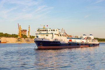 Fototapeta premium barges and cranes in the river port